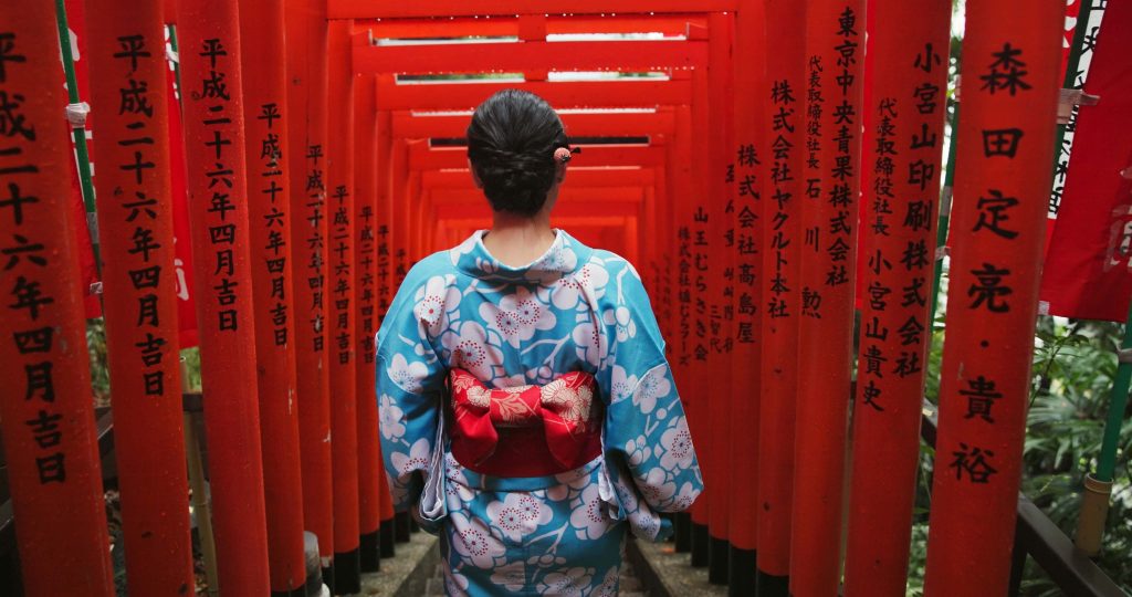 a woman wearing vintage kimono wandering in Sapporo